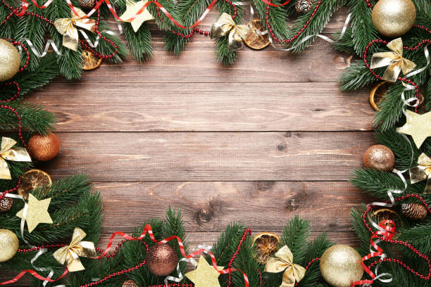 istock Colorful christmas decorations on brown wooden table 1067351584
