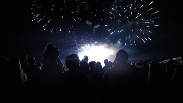 istock Crowd watching fireworks and celebrating new year 1067353716