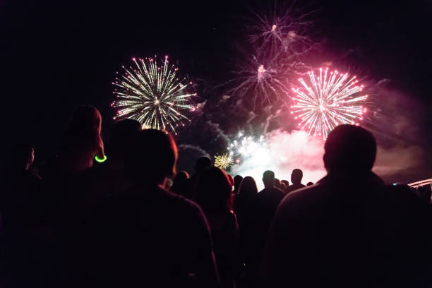 istock Crowd watching fireworks and celebrating new year eve 1067353774