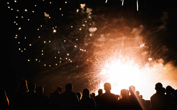 istock Crowd watching fireworks and celebrating new year eve 1067353776