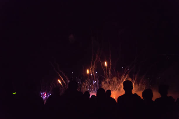 istock Crowd watching fireworks and celebrating new year eve 1067353818
