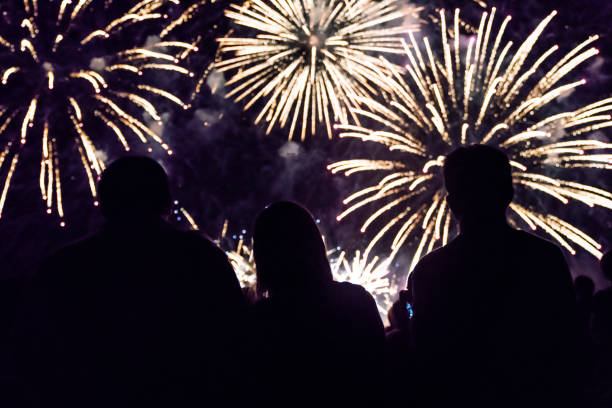 istock Crowd watching fireworks and celebrating new year eve 1067353868