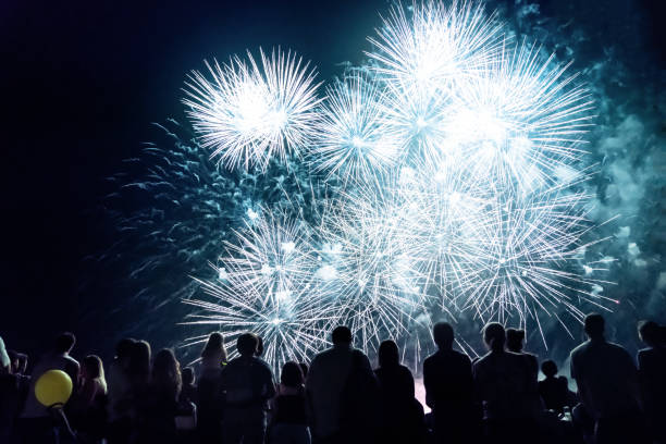 istock Crowd watching fireworks and celebrating new year 1067353940