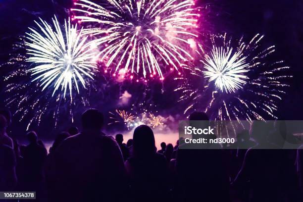 Crowd Watching Fireworks And Celebrating New Year Eve Stock Photo - Download Image Now
