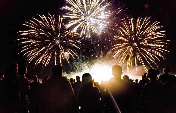 istock Crowd watching fireworks and celebrating new year eve 1067354380
