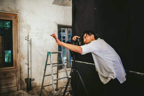 istock Professional photograher taking photos in his studio 1067357888