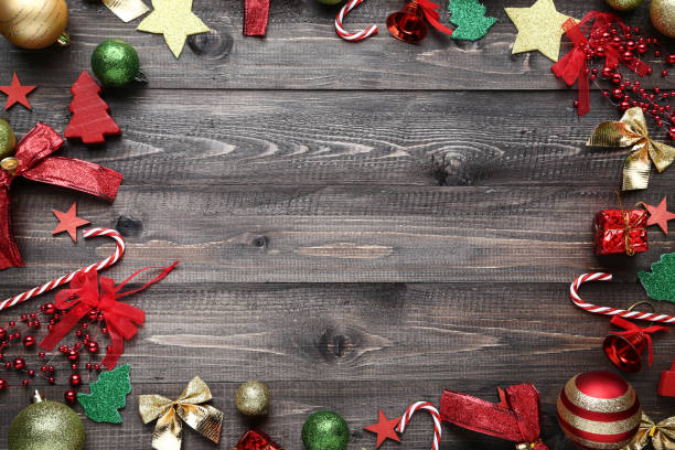 istock Colorful christmas decorations on wooden table 1067357934