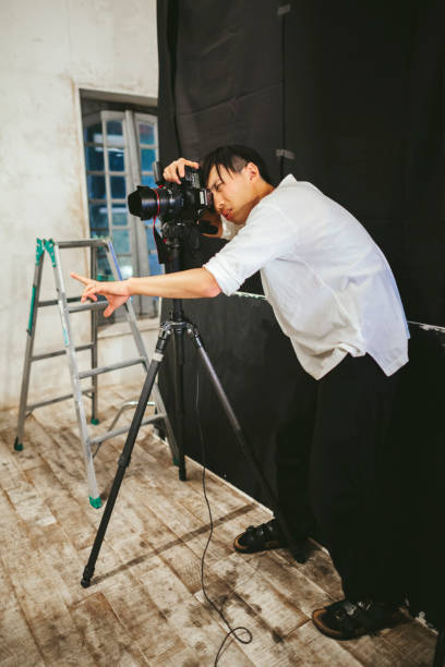 istock Professional photograher taking photos in his studio 1067358120