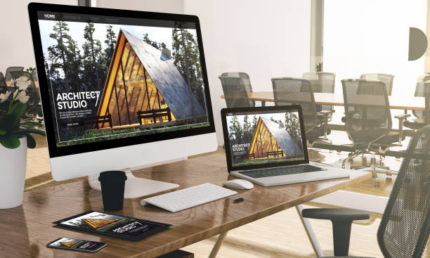 istock computer, laptop, tablet, and phone with architect studio website at office mockup 1067358372