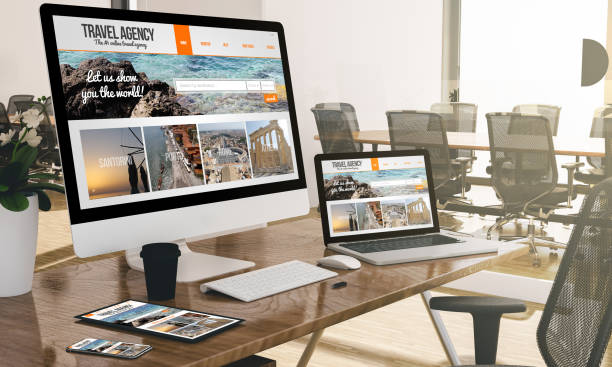 istock computer, laptop, tablet, and phone with responsive travel website  at office mockup 1067358414