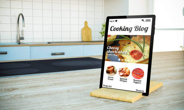 istock tablet pc with cooking blog screen on island at the kitchen 1067358606