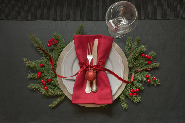 istock Christmas table setting with red decor on black. Top view. Xmas Party. 1067358672