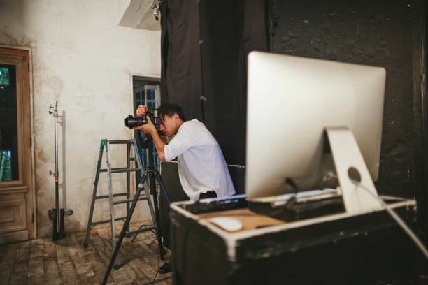 istock Professional photograher taking photos in his studio 1067361170