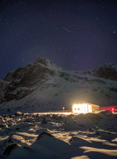 istock House lighting on snowy with starry over mountain 1067361208