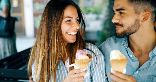 istock Happy couple having date and eating ice cream 1067367866
