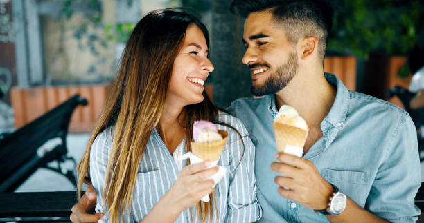 istock Happy couple having date and eating ice cream 1067367870