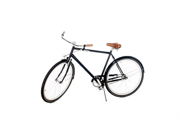 istock Black bicycle with wooden seat isolated on white 1067368142
