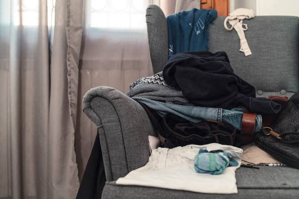 istock Messy room with scattered clothes on the armchair 1067369568