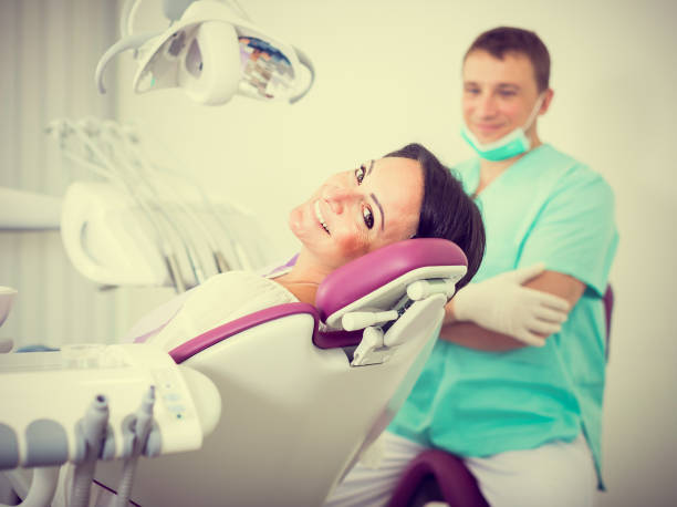 istock dentist  with positive visitor woman 1067370480