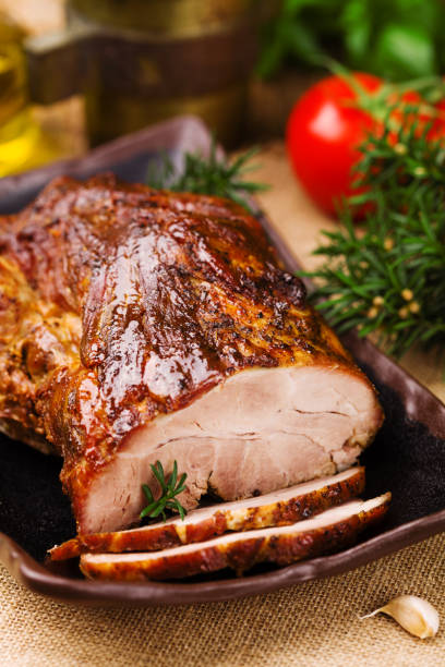 istock Roast pork with herbs and vegetables. 1067375742