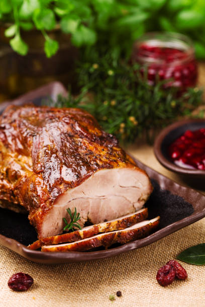 istock Roast pork with cranberry dip, basil, coriander and rosemary. 1067375782