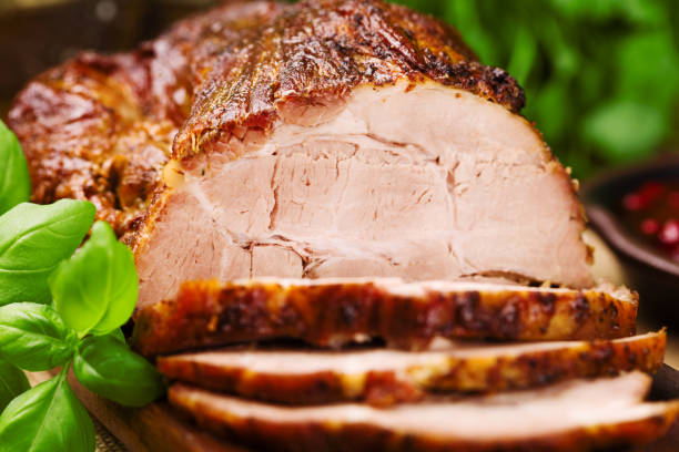 istock Roast pork with herbs and vegetables. 1067375870