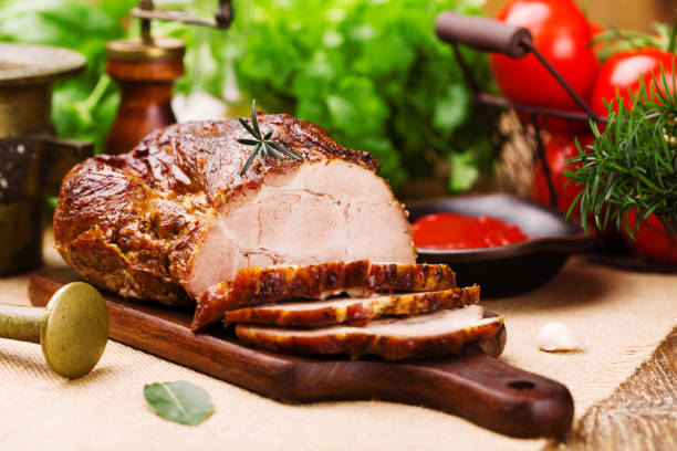 istock Roast pork with tomato dip and herbs. 1067375880