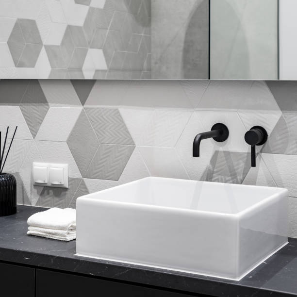istock Countertop washbasin with black faucet 1067379640