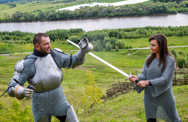istock A lady in chain mail and a knight in armor 1067380434