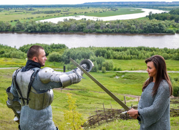 istock A lady in chain mail and a knight in armor 1067380472