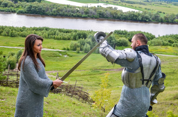 istock A lady in chain mail and a knight in armor 1067380514