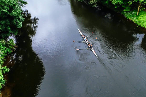 Rowing on the river Durham, England-June 15, 2016: A quad rowing on the river Wear. river wear stock pictures, royalty-free photos & images