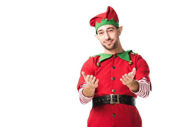 istock smiling man in christmas elf costume with outstretched hands gesture isolated on white 1067384128