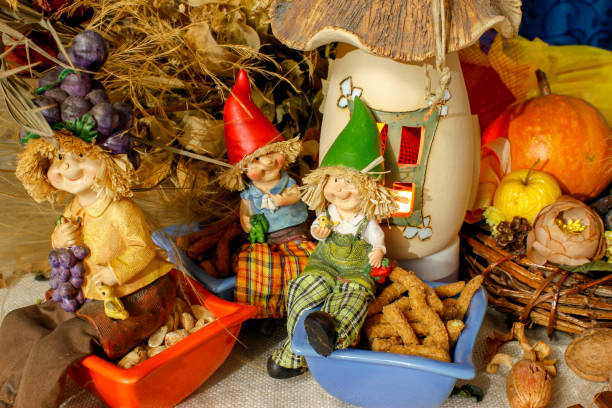 istock Beautiful composition iwith figurines of child's, snacks, dry leaves, walnuts and rustic decoration 1067386928
