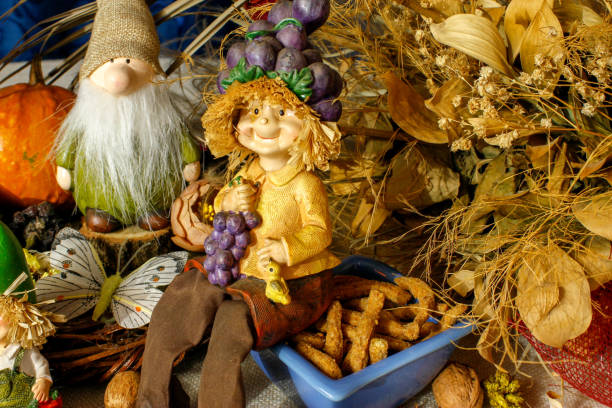 istock Beautiful composition iwith figurines of child's, snacks, dry leaves, walnuts and rustic decoration 1067386944