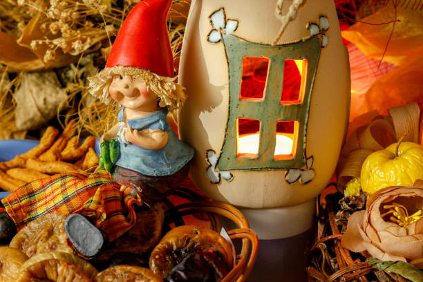 istock Beautiful composition iwith figurines of child's, snacks, dry leaves, walnuts and rustic decoration 1067386948