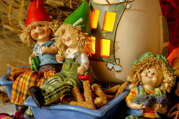 istock Beautiful composition iwith figurines of child's, snacks, dry leaves, walnuts and rustic decoration 1067387028