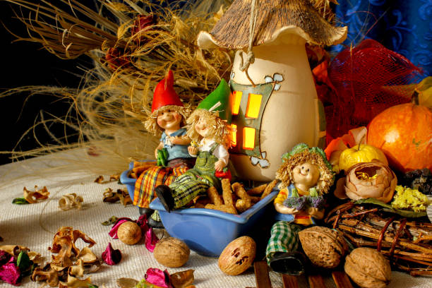 istock Beautiful composition iwith figurines of child's, snacks, dry leaves, walnuts and rustic decoration 1067387072