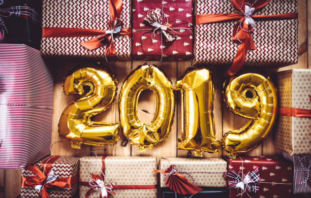 istock christmas present on parquet floor for the new year 2019 1067390680