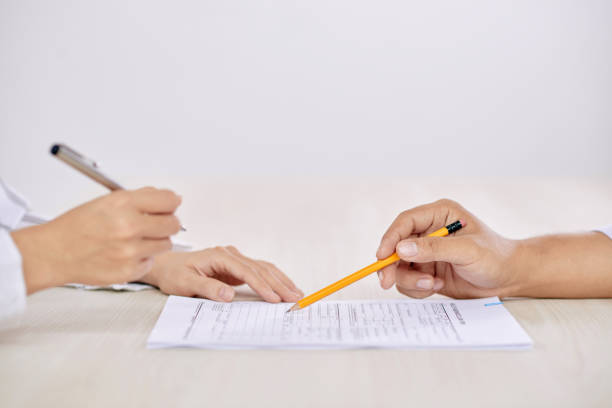 istock Crop people signing contract 1067397594