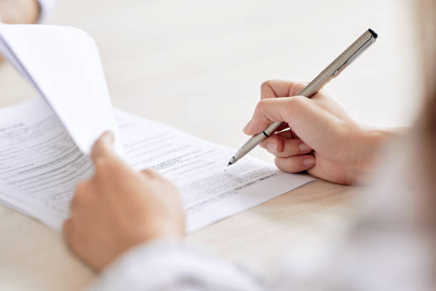 istock Crop person signing contract 1067397596