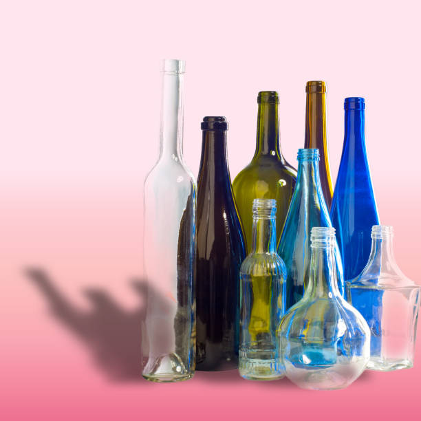 istock Background pattern, texture. Empty bottles of studio photography. Glass bottles of mixed colors, including green, transparent white, brown and blue. Group of bottles 1067397680