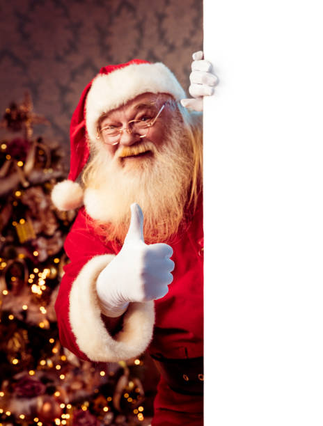 istock Santa Claus pointing on blank banner 1067400628