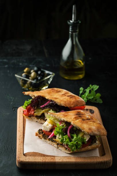 istock Delicious sandwich with vegetables, olives and pesto 1067400824