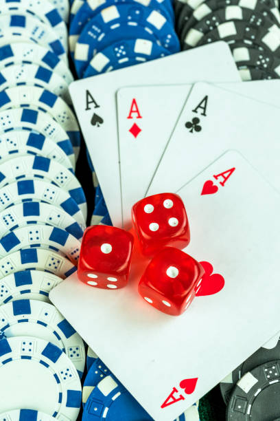 istock Gambling Red Dice Poker Cards and Coins 1067408170