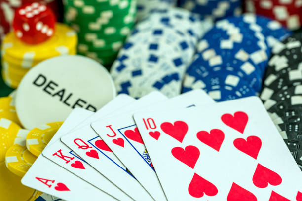 istock Gambling Red Dice Poker Cards and Coins 1067408496