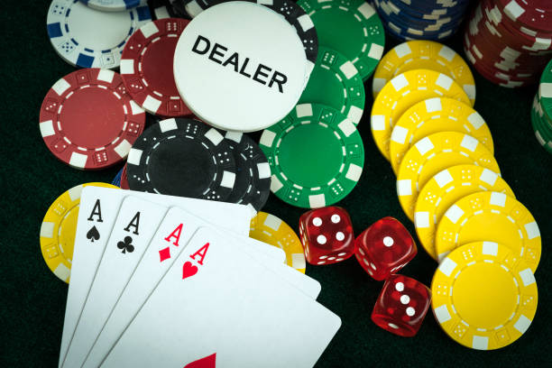 istock Gambling Red Dice Poker Cards and Coins 1067408702