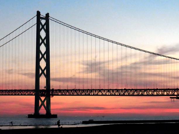 istock Cloudy skies and Akashi Kaikyo Bridge. 1067408962