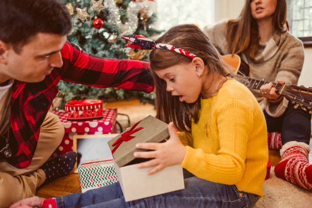 istock its time for opening the Christmas presents 1067409746