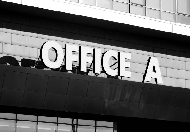 istock Giant inscription on office building facade. 1067414810
